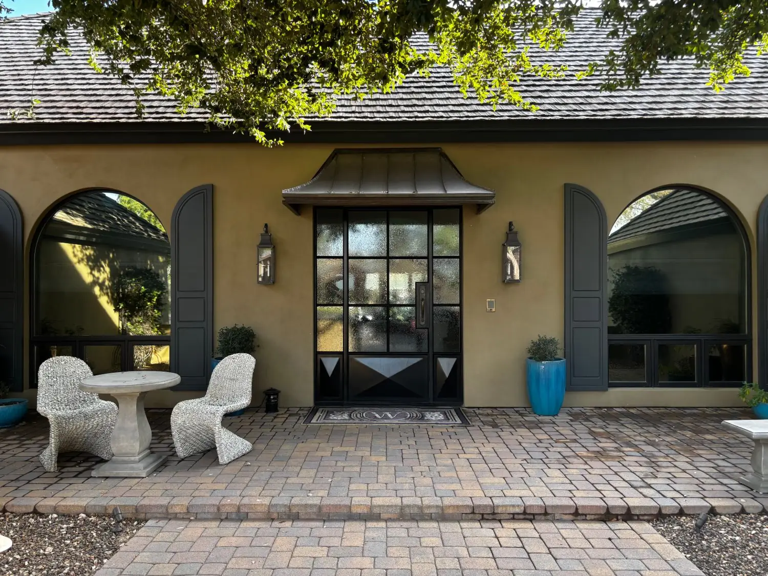 Clean arched windows and steel entry door
