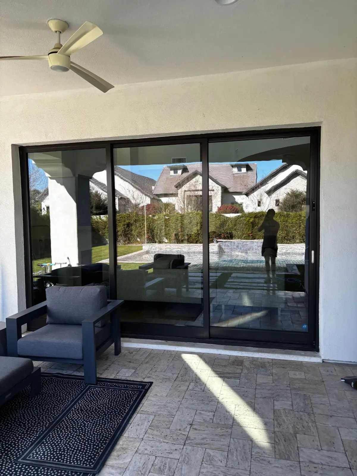 Spotless black sliding doors with pool view