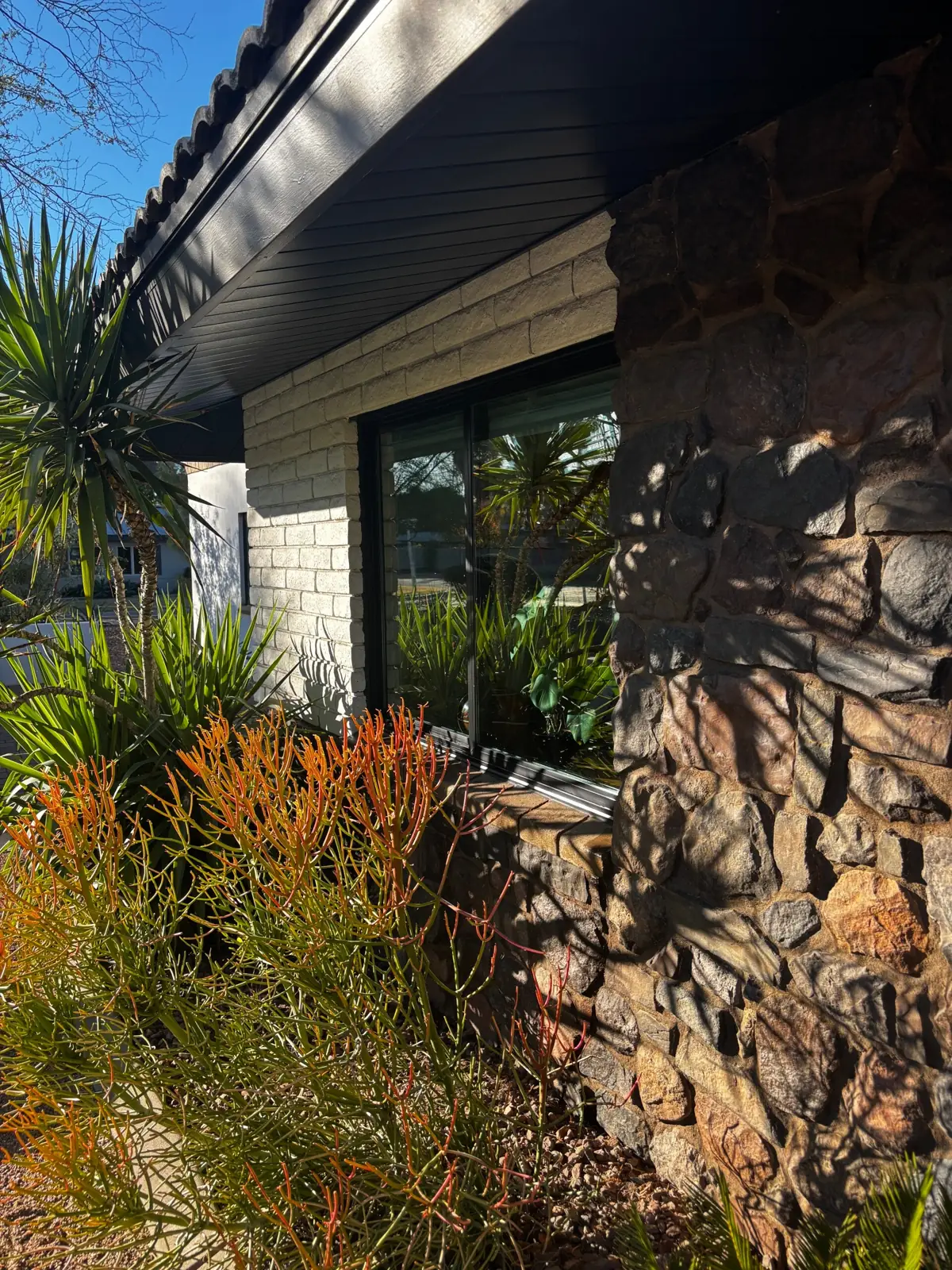 Clean window on a desert stone home
